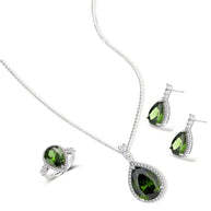 White gold plated jewelry set with green teardrop gemstones and cubic zirconia halos on cream background.
